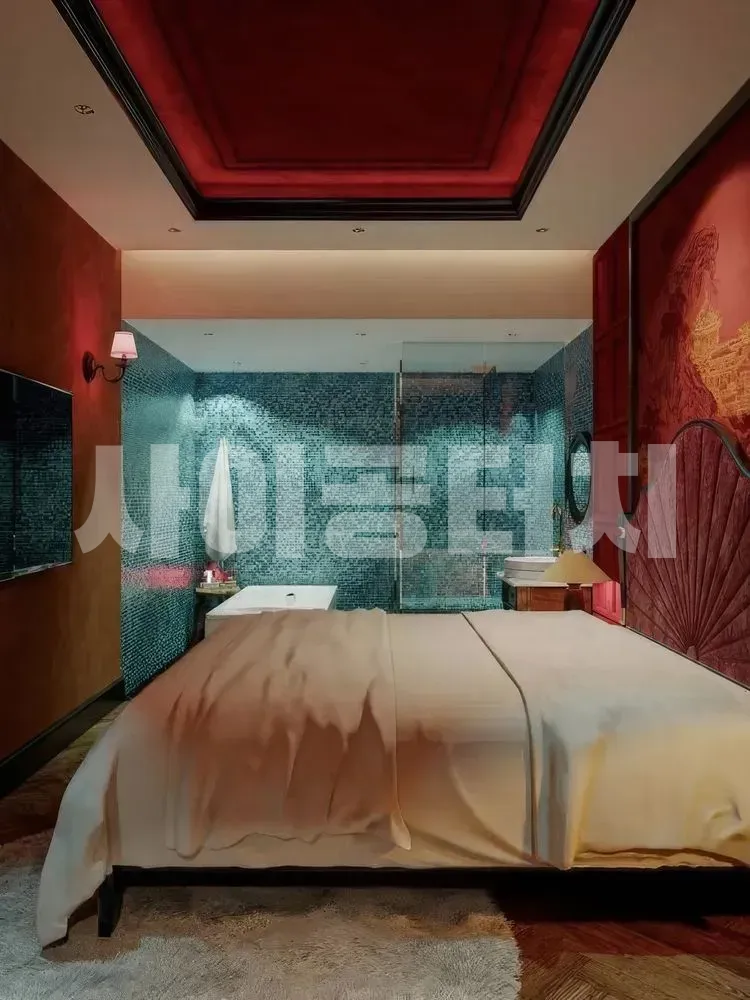 붉은 조명 아래 고급스러운 마사지 룸